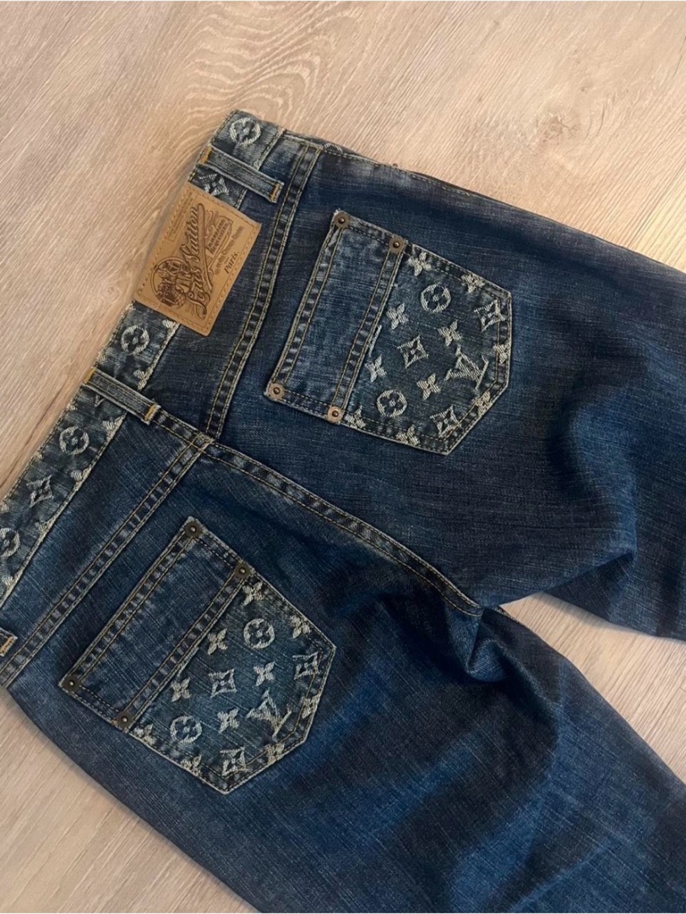 Louis Vuitton dark wash low rise logo jeans